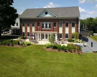 The Scituate Senior Center from the lawn, with brick wing and patio